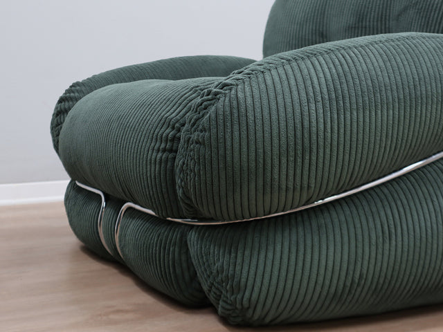 Adriano Piazzesi in the 1970s for the iconic Okay Collection, the armchairs feature a chromed tubular metal frame that enhances their sculptural, rounded lines