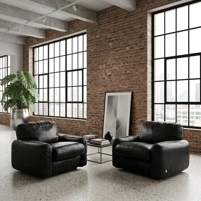 Pair 1970s Busnelli Piumotto black leather lounge armchairs Italian