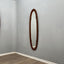 Campo e Graffi 1960s oval teak mirror, shell shape with circular mid-point accents. Totally restore, excellent condition. Unique vintage mirror commands attention.