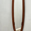 Campo e Graffi 1960s oval teak mirror, shell shape with circular mid-point accents. Totally restore, excellent condition. Unique vintage mirror commands attention.
