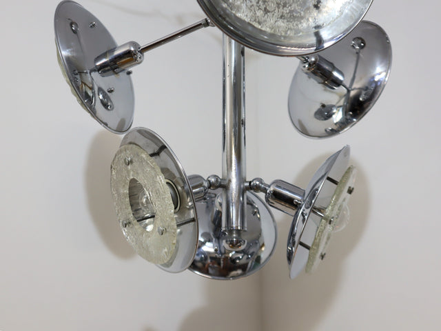 1970s chandelier Esperia, combining the brilliance of chrome-plated metal with the refinement of Murano glass shades. The vertical structure extends into six adjustable arms