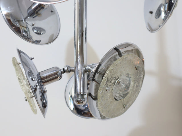 1970s chandelier Esperia, combining the brilliance of chrome-plated metal with the refinement of Murano glass shades. The vertical structure extends into six adjustable arms