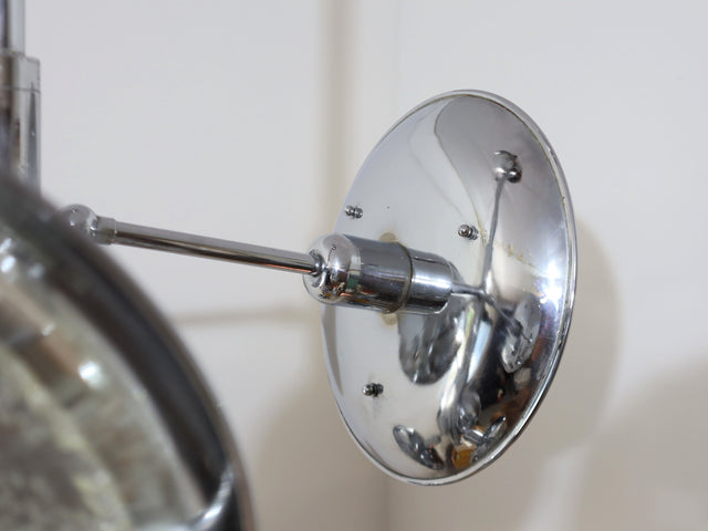 1970s chandelier Esperia, combining the brilliance of chrome-plated metal with the refinement of Murano glass shades. The vertical structure extends into six adjustable arms