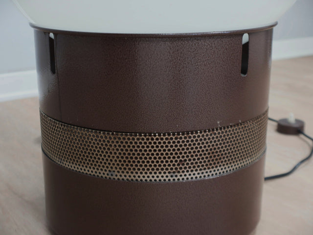 Gae Aulenti "Mezzo Oracolo" lamp for Artemide. Its commanding opaline glass globe acts as a luminous dome, diffusing light with a warm, ethereal glow. Below, the cylindrical metal base