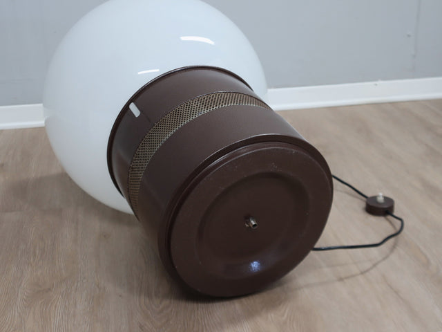 Gae Aulenti "Mezzo Oracolo" lamp for Artemide. Its commanding opaline glass globe acts as a luminous dome, diffusing light with a warm, ethereal glow. Below, the cylindrical metal base