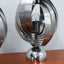 Paire de lampes de table spirales cinétiques Henri Mathieu des années 1970 en acier brossé et socle chromé allumées