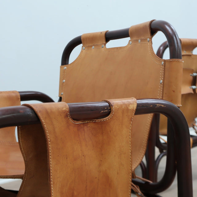 This original set of 1960s lounge chairs, designed by Tito Agnoli bamboo and leather arcmhair, lounge chair Bonacina vintage Fauteuils en bambou et cuir..