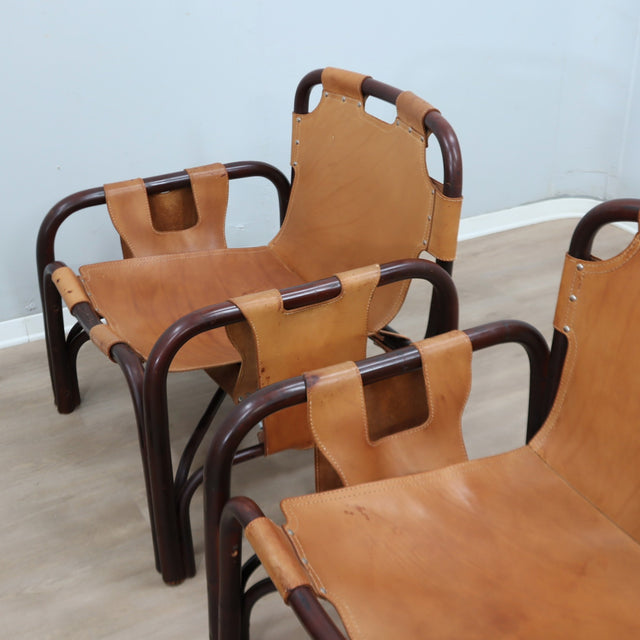 This original set of 1960s lounge chairs, designed by Tito Agnoli bamboo and leather arcmhair, lounge chair Bonacina vintage Fauteuils en bambou et cuir..