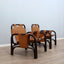 This original set of 1960s lounge chairs, designed by Tito Agnoli bamboo and leather arcmhair, lounge chair Bonacina vintage Fauteuils en bambou et cuir..