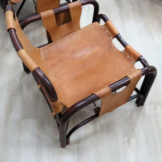 This original set of 1960s lounge chairs, designed by Tito Agnoli bamboo and leather arcmhair, lounge chair Bonacina vintage Fauteuils en bambou et cuir..
