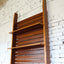 Asymmetric 1950s Italian teak wall unit with slatted back and plywood shelves. Teak Regal, estantería teca, bibliothèque teck, libreria dogat