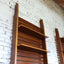 Asymmetric 1950s Italian teak wall unit with slatted back and plywood shelves. Teak Regal, estantería teca, bibliothèque teck, libreria dogat