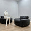Pair of 1970s Italian Busnelli Piumotto black leather armchairs with original stamped ABS bases. Coppia poltrone Piumotto Busnelli in pelle nera.