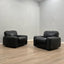Pair of 1970s Italian Busnelli Piumotto black leather armchairs with original stamped ABS bases. Coppia poltrone Piumotto Busnelli in pelle nera.