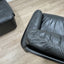 Pair of 1970s Italian Busnelli Piumotto black leather armchairs with original stamped ABS bases. Coppia poltrone Piumotto Busnelli in pelle nera.