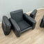 Pair of 1970s Italian Busnelli Piumotto black leather armchairs with original stamped ABS bases. Coppia poltrone Piumotto Busnelli in pelle nera.