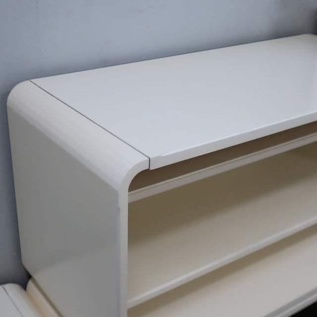 1960s Italian Space Age white lacquered modular bookcase system with smoked glass doors and open shelving modules in a clean minimalist set.   
