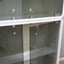 1960s Italian Space Age white lacquered modular bookcase system with smoked glass doors and open shelving modules in a clean minimalist set.   